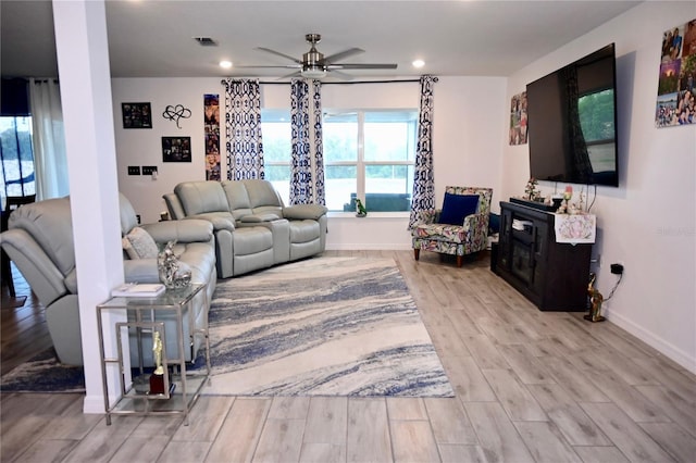 673 Sarner Pass Way, Winter Haven, FL 33881 - living room featuring a ceiling fan, wood finished floors, recessed lighting, and baseboards