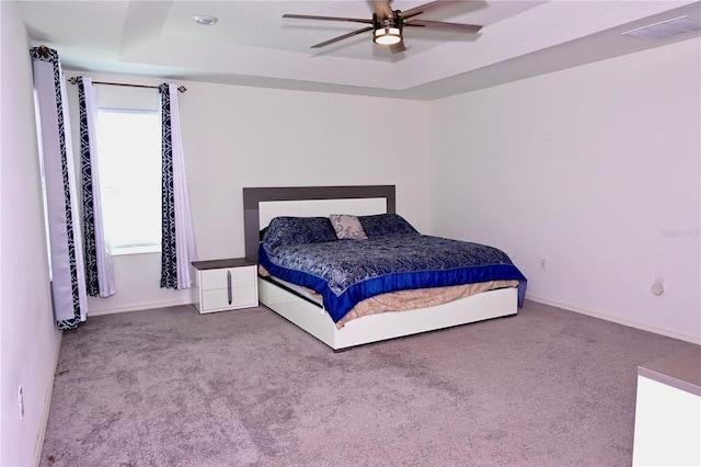 673 Sarner Pass Way, Winter Haven, FL 33881 - bedroom featuring carpet flooring, a tray ceiling, a ceiling fan, and baseboards