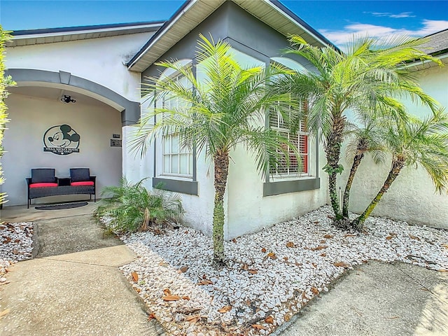 550 Canary Island Cir, Davenport, FL 33837 - doorway to property with stucco siding