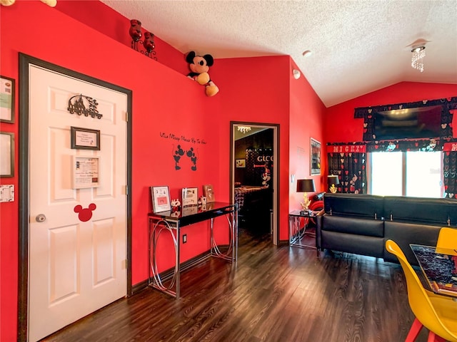 550 Canary Island Cir, Davenport, FL 33837 - living area with vaulted ceiling, wood finished floors, and a textured ceiling