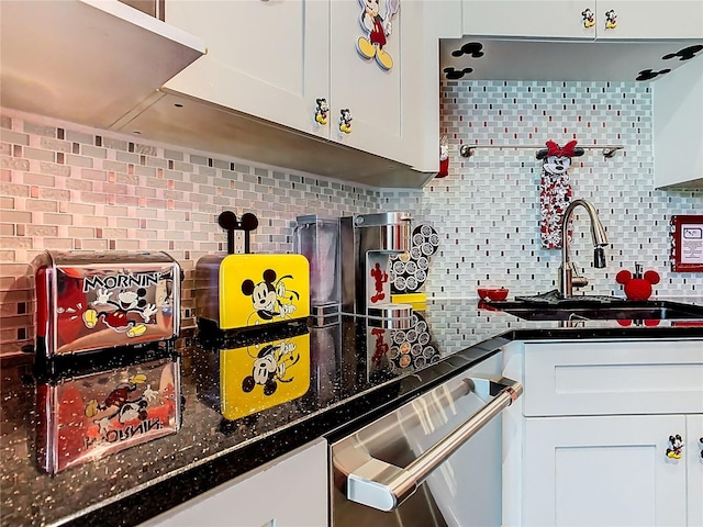 550 Canary Island Cir, Davenport, FL 33837 - kitchen featuring dishwasher, backsplash, white cabinets, and a sink