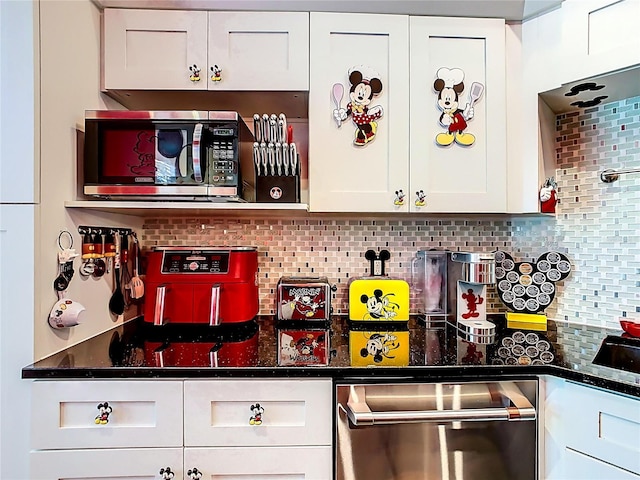 550 Canary Island Cir, Davenport, FL 33837 - bar area featuring stainless steel appliances and decorative backsplash
