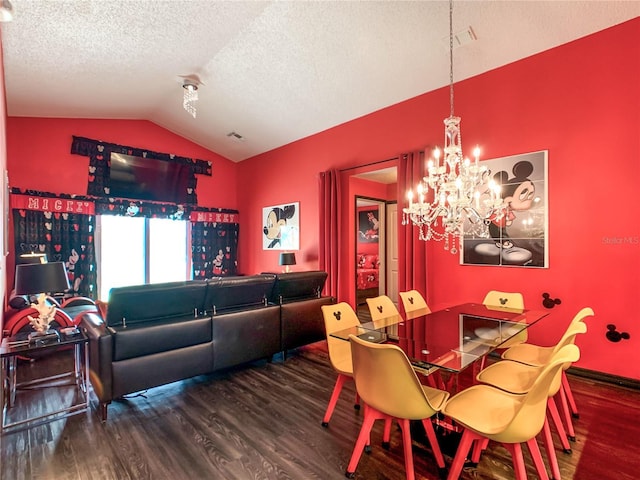 550 Canary Island Cir, Davenport, FL 33837 - dining room featuring vaulted ceiling, wood finished floors, a chandelier, a textured ceiling, and baseboards