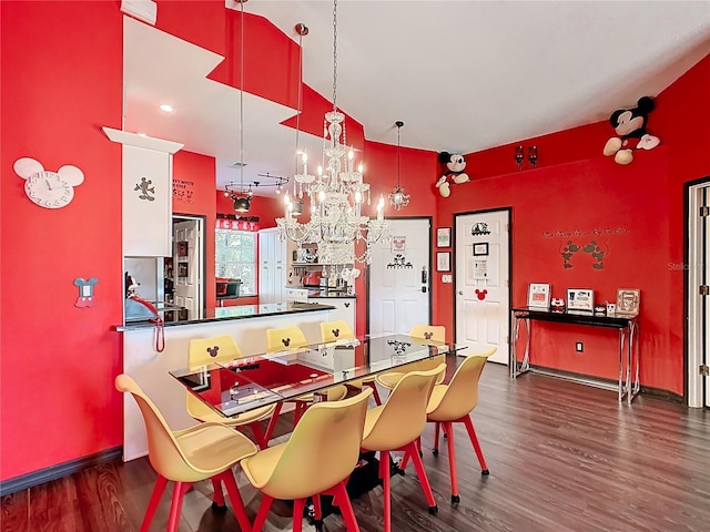 550 Canary Island Cir, Davenport, FL 33837 - dining area with wood finished floors, a chandelier, baseboards, and high vaulted ceiling