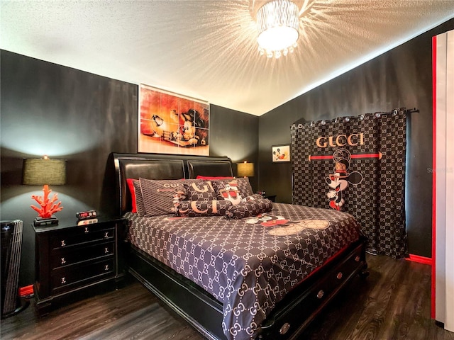 550 Canary Island Cir, Davenport, FL 33837 - bedroom featuring wood finished floors and a textured ceiling