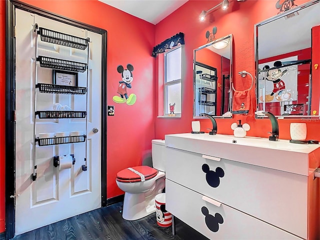 550 Canary Island Cir, Davenport, FL 33837 - half bath featuring wood finished floors, toilet, and vanity