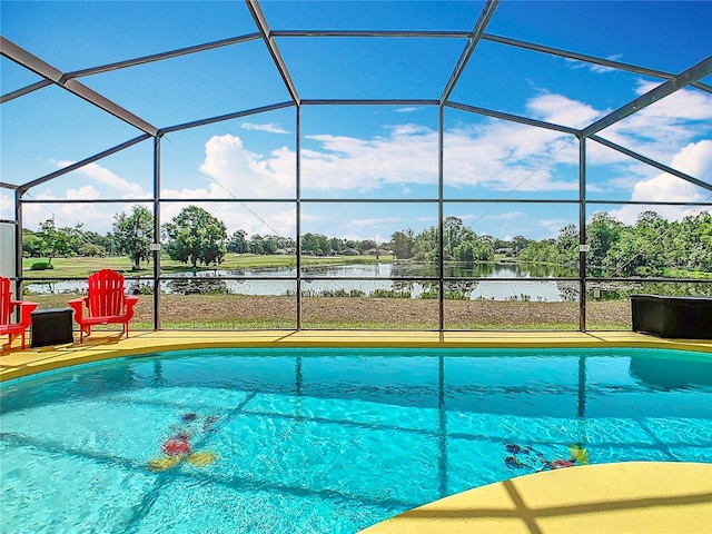 550 Canary Island Cir, Davenport, FL 33837 - outdoor pool featuring a lanai, a water view, and a patio area