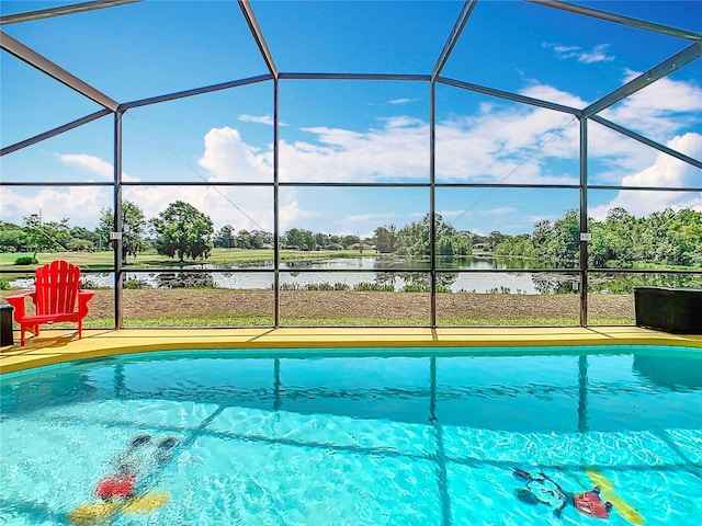 550 Canary Island Cir, Davenport, FL 33837 - outdoor pool featuring glass enclosure and a water view