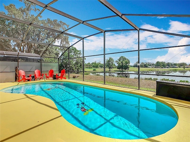 550 Canary Island Cir, Davenport, FL 33837 - outdoor pool with a water view, a patio, and a lanai