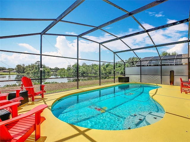 550 Canary Island Cir, Davenport, FL 33837 - swimming pool featuring a water view, a patio area, and a lanai