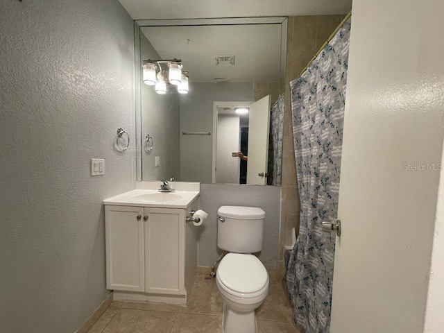 full bathroom featuring tile patterned flooring, toilet, vanity, a shower with curtain, and a textured wall