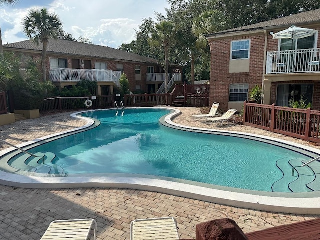 community pool featuring a patio