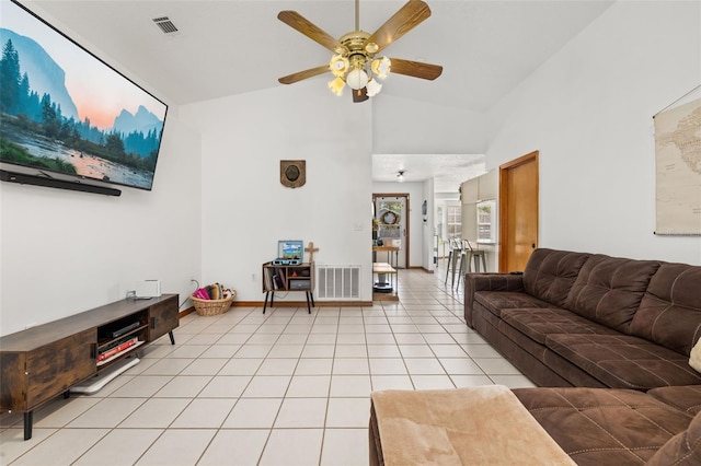 living room featuring ceiling fan, light tile patterned floors, high vaulted ceiling, and baseboards