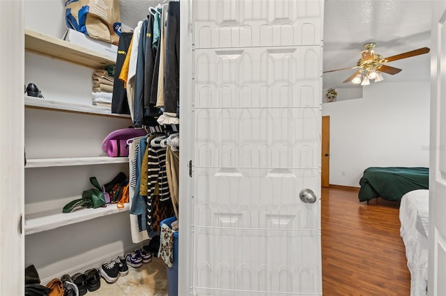 bedroom with baseboards and wood finished floors