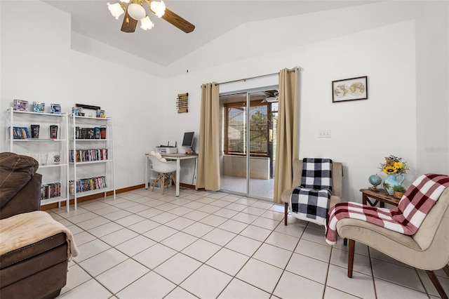 home office with vaulted ceiling, a ceiling fan, light tile patterned flooring, and baseboards