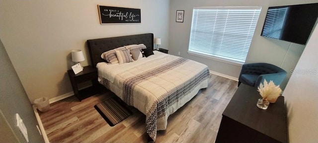 2729 Club Cortile Cir, Kissimmee, FL 34746 - bedroom with wood finished floors and baseboards