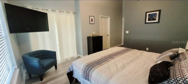 2729 Club Cortile Cir, Kissimmee, FL 34746 - bedroom featuring wood finished floors