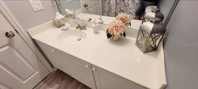 2729 Club Cortile Cir, Kissimmee, FL 34746 - bathroom featuring vanity and wood finished floors