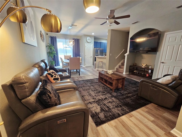 2531 Old Kent Cir, Kissimmee, FL 34758 - living room featuring a ceiling fan and wood finished floors