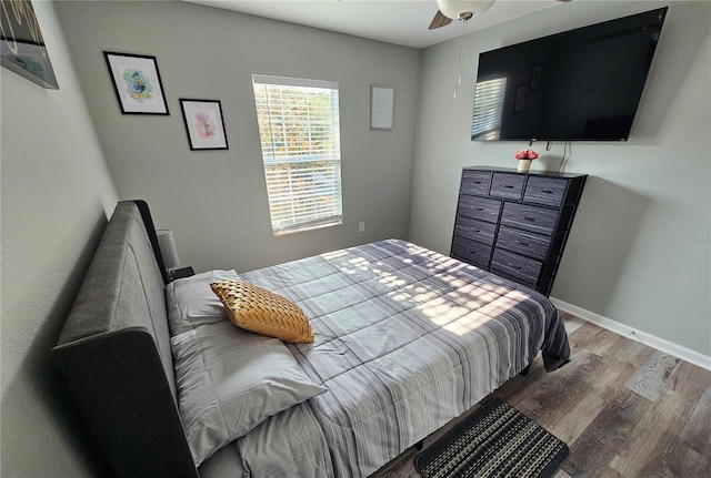 2531 Old Kent Cir, Kissimmee, FL 34758 - bedroom with wood finished floors, baseboards, and a ceiling fan