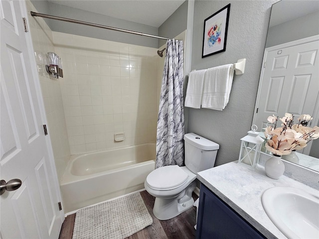 2531 Old Kent Cir, Kissimmee, FL 34758 - bathroom with wood finished floors, toilet, vanity, and shower / bath combo with shower curtain