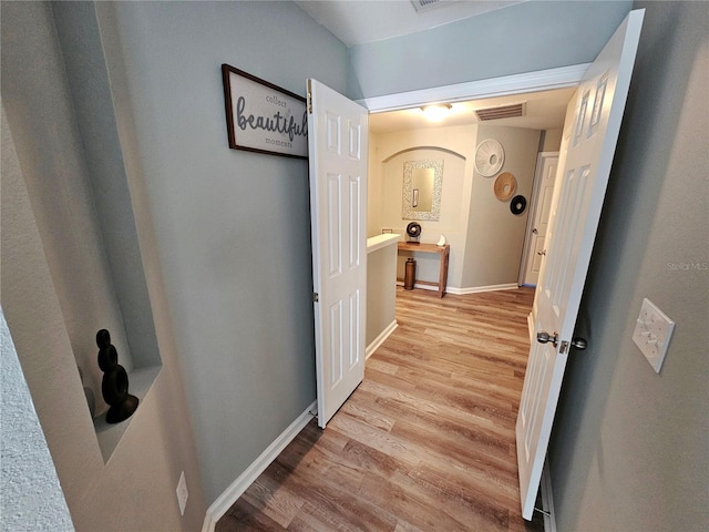 2531 Old Kent Cir, Kissimmee, FL 34758 - hallway featuring light wood-type flooring and baseboards