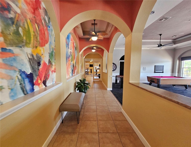 2531 Old Kent Cir, Kissimmee, FL 34758 - hallway with a raised ceiling, tile patterned floors, and baseboards