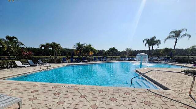 2531 Old Kent Cir, Kissimmee, FL 34758 - community pool featuring a patio