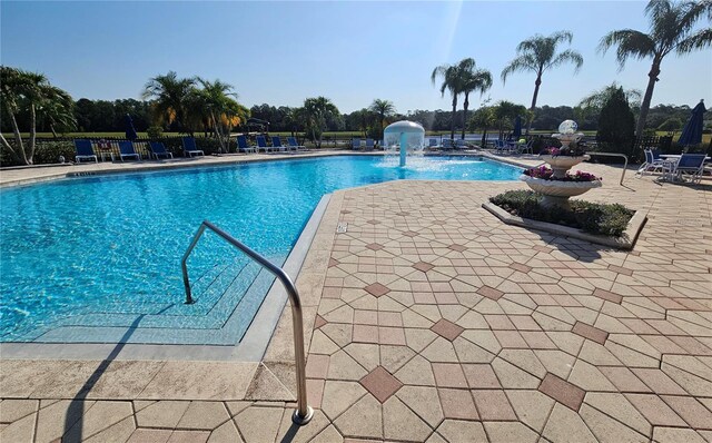 2531 Old Kent Cir, Kissimmee, FL 34758 - community pool featuring a patio area