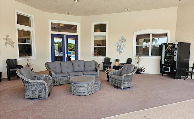 2531 Old Kent Cir, Kissimmee, FL 34758 - living room featuring carpet floors, french doors, and a textured ceiling