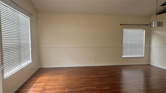 979 Hacienda Cir, Kissimmee, FL 34741 - spare room with wood finished floors and baseboards