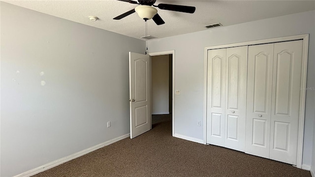 979 Hacienda Cir, Kissimmee, FL 34741 - unfurnished bedroom featuring carpet flooring, baseboards, a closet, ceiling fan, and a textured ceiling