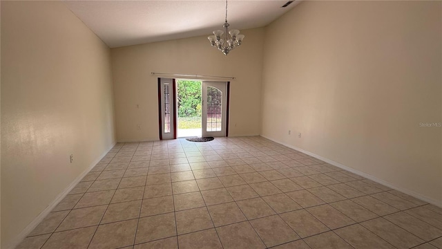 979 Hacienda Cir, Kissimmee, FL 34741 - unfurnished room with a chandelier, light tile patterned floors, high vaulted ceiling, and baseboards