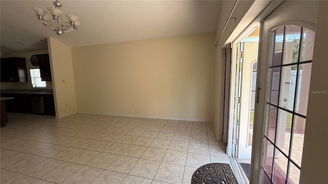 979 Hacienda Cir, Kissimmee, FL 34741 - interior space featuring a chandelier, light tile patterned floors, and baseboards