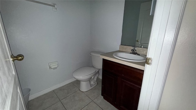 979 Hacienda Cir, Kissimmee, FL 34741 - bathroom with tile patterned floors, vanity, and toilet