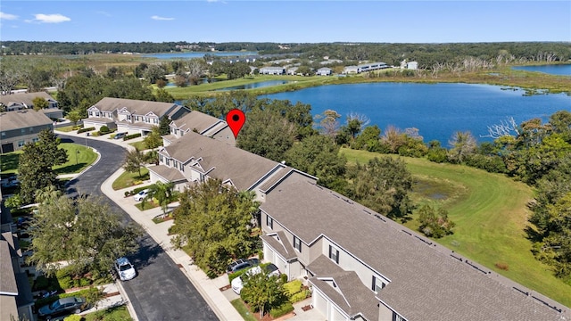 aerial view of residential area with a nearby body of water