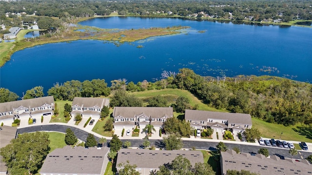 aerial view of residential area with a large body of water