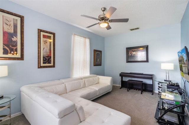 8571 La Isla Dr, Kissimmee, FL 34747 - carpeted living room featuring ceiling fan and baseboards