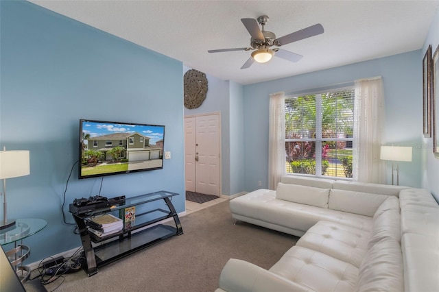 8571 La Isla Dr, Kissimmee, FL 34747 - living area with carpet floors and a ceiling fan