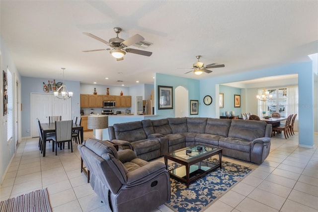 8571 La Isla Dr, Kissimmee, FL 34747 - living room with a chandelier, light tile patterned flooring, and ceiling fan