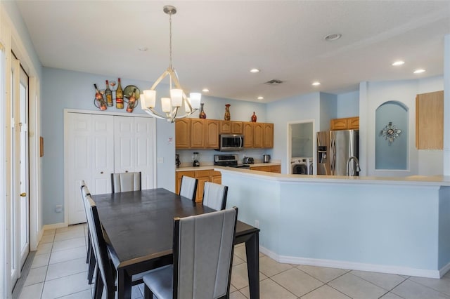 8571 La Isla Dr, Kissimmee, FL 34747 - dining area with a chandelier, recessed lighting, and light tile patterned floors