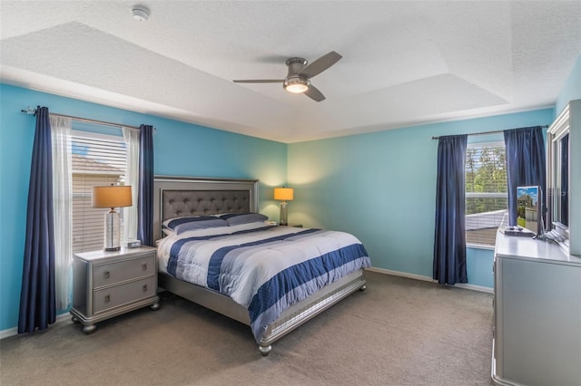 8571 La Isla Dr, Kissimmee, FL 34747 - bedroom with carpet floors, ceiling fan, and a textured ceiling