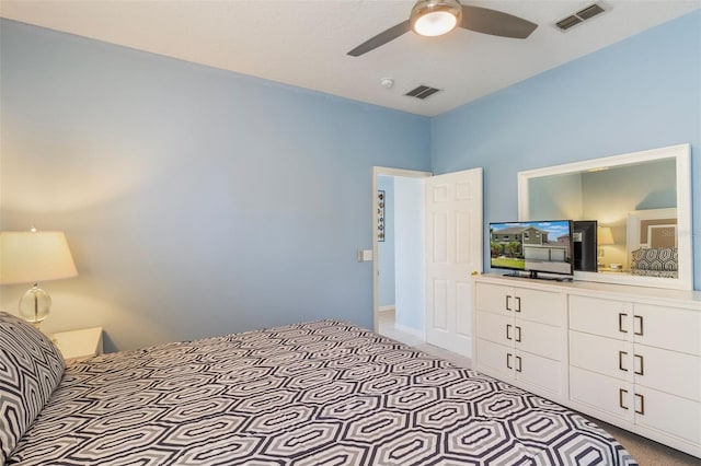 8571 La Isla Dr, Kissimmee, FL 34747 - bedroom featuring a ceiling fan and light carpet