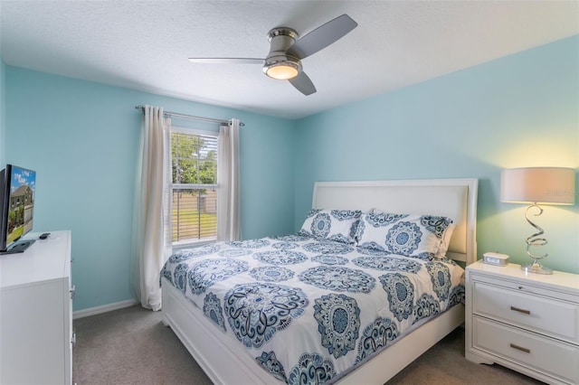 8571 La Isla Dr, Kissimmee, FL 34747 - bedroom with dark carpet and ceiling fan