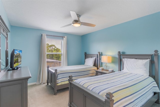 8571 La Isla Dr, Kissimmee, FL 34747 - bedroom featuring light carpet and ceiling fan