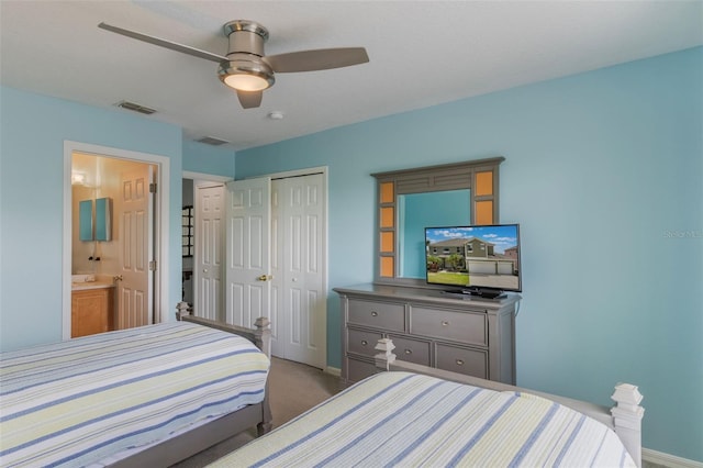 8571 La Isla Dr, Kissimmee, FL 34747 - bedroom with a closet, ensuite bathroom, carpet flooring, and ceiling fan