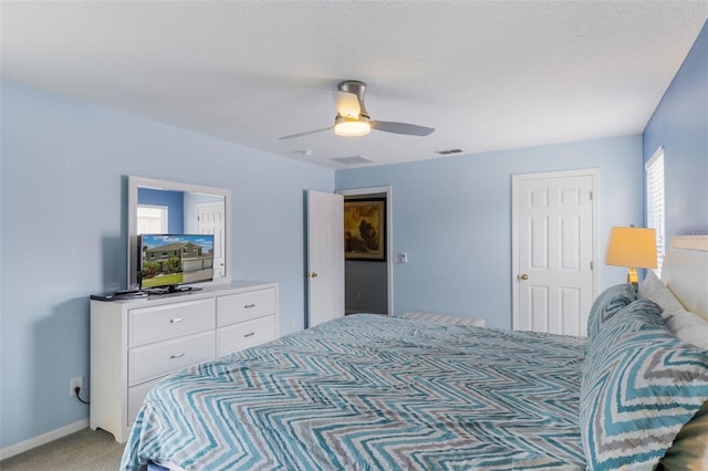 8571 La Isla Dr, Kissimmee, FL 34747 - bedroom with light colored carpet and a ceiling fan