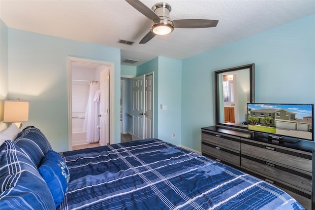 8571 La Isla Dr, Kissimmee, FL 34747 - bedroom with connected bathroom and a ceiling fan