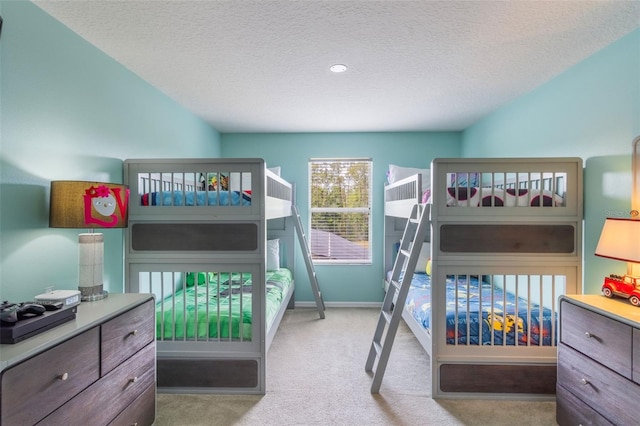8571 La Isla Dr, Kissimmee, FL 34747 - carpeted bedroom featuring a textured ceiling and baseboards