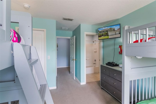 8571 La Isla Dr, Kissimmee, FL 34747 - bedroom featuring carpet flooring and a textured ceiling